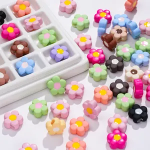 Macro shot of colorful matte acrylic flower beads for handmade DIY jewelry crafting and design