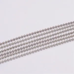 Macro shot of silver ball chain strands for jewelry making with polished metal finish