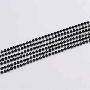 Detailed macro view of five parallel black metal ball chains for DIY jewelry making projects