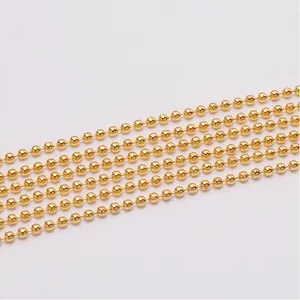 Macro shot of gold-plated metal bead chain for DIY jewelry making and necklaces