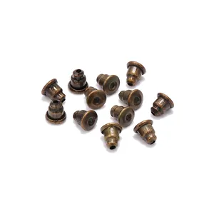 Antique bronze bullet earring backs set for DIY jewelry making on white background