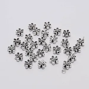 Vintage silver flower spacers for DIY jewelry making with six-petal metal bead design