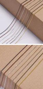 Detailed close-up of colorful metal O-shaped jewelry chains in gold, silver and copper