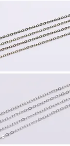 Detail of flat O-shaped metal chains in antique bronze and silver for DIY jewelry