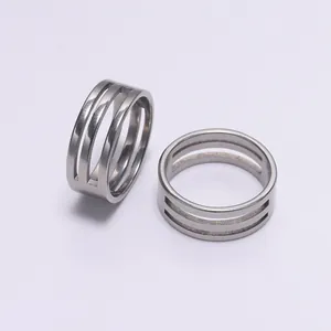 Close-up of dual stainless steel ring opening tools with triple parallel grooves