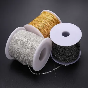 Flat O-shaped metal chains in gold, silver, and black on rolls for DIY jewelry making