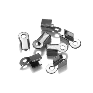 Macro detail of polished silver metal cord end crimp connectors for DIY jewelry making