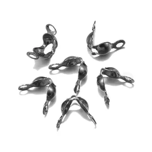 Macro detail of antique silver metal double-loop bead tips for DIY jewelry making