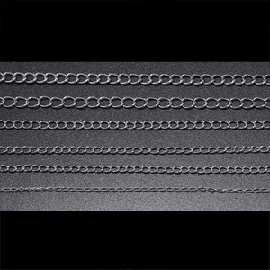 Detail showing six sizes of silver stainless steel curb chains for DIY jewelry making
