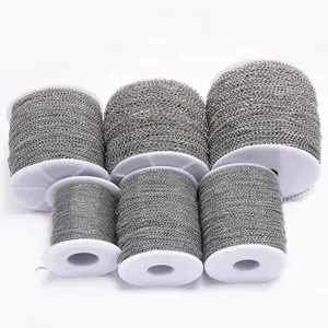 Set of six stainless steel flat round curb chains on white spools for DIY jewelry making