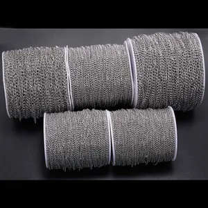 Detailed macro view of silver stainless steel link chain on spools for DIY jewelry making