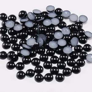 Detailed view of glossy black flatback ABS imitation pearls for DIY crafts and nail art