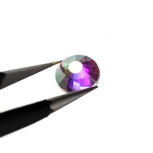 AB crystal rhinestone with multifaceted cut shown held by black tweezers on white background