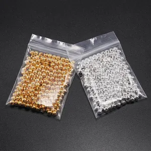 Perline metalliche oro e argento con fori per gioielli fai-da-te in sacchetti