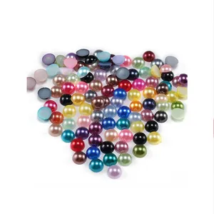 Close-up of colorful flatback ABS pearl beads for nail art and DIY jewelry crafts