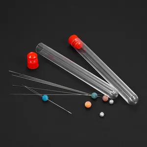 Detailed view of DIY beading needles set with storage tubes and decorative beads