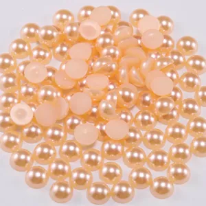 Close-up of champagne flatback half round pearls for DIY jewelry and nail art