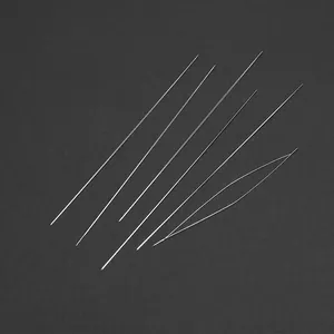 Macro shot of assorted stainless steel beading needles with a large eye needle for DIY crafts