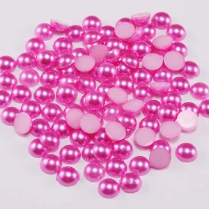 Detailed macro view of rose pink half round ABS imitation pearls for DIY crafts and nail art