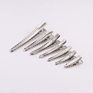 Close-up of 7 pieces set silver metal hair clips in various sizes for DIY styling