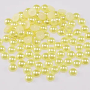 Detailed view of cream-colored flatback ABS half pearls for DIY crafts and nail art