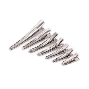 Set of seven silver metal alligator hair clips in various sizes for DIY styling