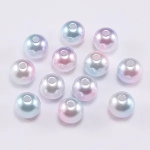 Macro detail of gradient macaron aurora pearls with central holes for DIY jewelry making