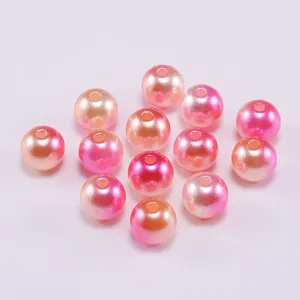 Macro detail of gradient pink ABS imitation pearl beads with holes for DIY jewelry making