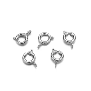 Five silver stainless steel spring ring clasps for DIY jewelry making on white background