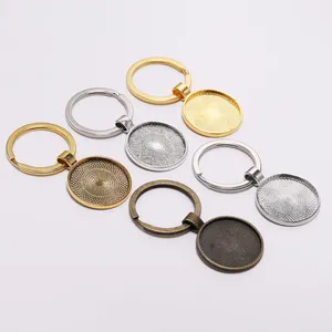 Pendentifs porte-clés DIY ronds en alliage avec bases texturées en cinq finitions métal