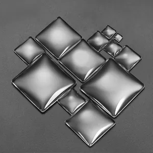 Macro shot of multiple sizes of clear square glass cabochons for DIY jewelry making