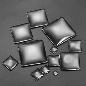 Close-up of clear square glass cabochons with flat back for DIY jewelry making