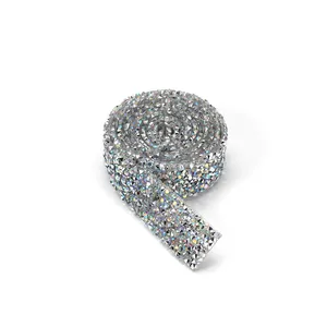 Close-up of sparkling silver AB rhinestone ribbon roll for DIY dress decoration