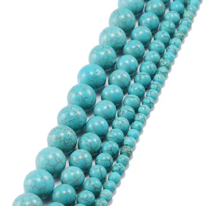 Detailed view of turquoise round beads in various sizes for DIY jewelry making