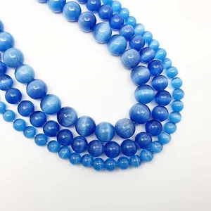 Macro shot of blue cat eye stone beads in different sizes for DIY jewelry making