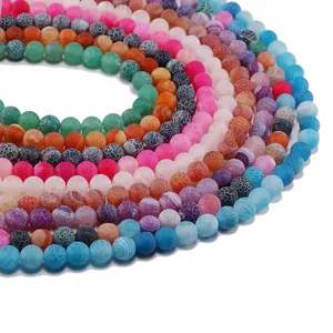 Macro shot of colorful weathered agate beads with unique crackle patterns for DIY crafts