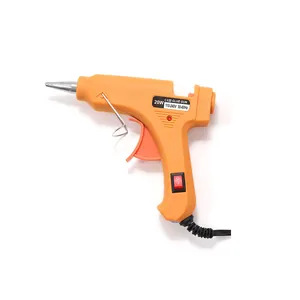 Detail view of 20W orange hot glue gun showing precision nozzle and 110-240V power switch