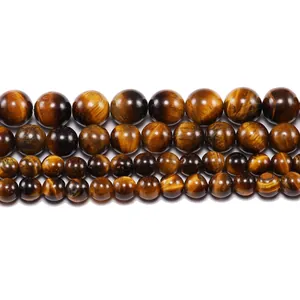 Macro detail of natural tiger eye stone beads in four sizes for DIY jewelry making