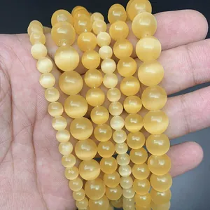 Five strands of 8mm yellow cat eye stone beads showcasing unique optical cat eye effect
