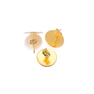 Detailed view of gold stainless steel flat pad earring studs with butterfly backs