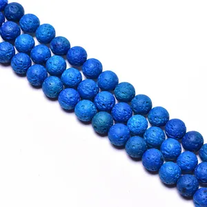 Macro detail of blue volcanic lava stone beads showing porous texture and round shape