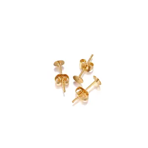 Detail view of gold-plated stainless steel flat pad earring studs with butterfly backs