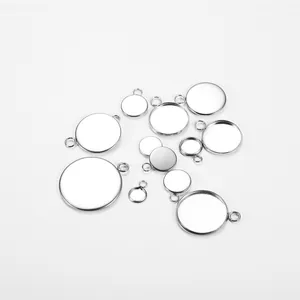 Detailed view of assorted silver stainless steel bezel pendant trays for DIY jewelry