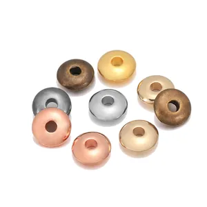 Macro view of 8mm metallic disc spacer beads in gold silver and bronze for DIY jewelry