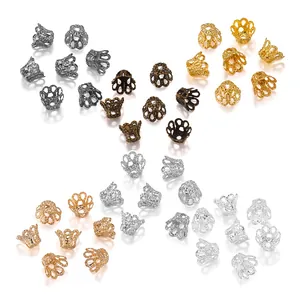 Détail de calottes de perles ajourées en six finitions métalliques pour bijoux DIY