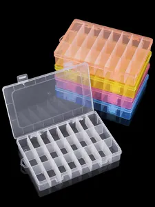 Detail of 24-compartment plastic storage box showing removable dividers and multiple colors