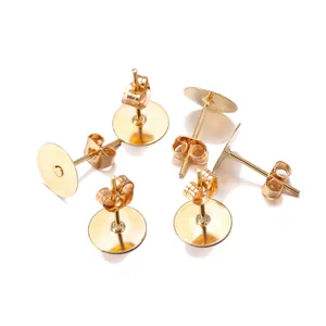 Detailed view of DIY gold disc stud earrings with butterfly backs for jewelry making