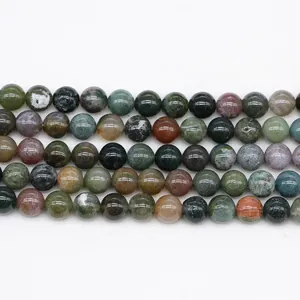 Macro view of natural Indian agate round beads with smooth texture and mixed earth tones