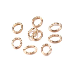 Macro shot of gold-plated oval open jump rings for DIY necklace and bracelet jewelry making