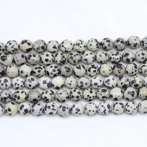 Macro shot of natural Dalmatian Jasper round beads for DIY jewelry making